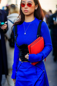 marx mae, blue pullover, blue skirt, black vinyl top, black polish top, sleeveless top, corset top, belted pullover, silvered necklace, letters necklace, red sunglasses, red leather clutch, metalic frame sunglasses, small sunglasses, diamond earrings, fashion week, frenchystyle, FW, jonathan paciullo, street style, MFW, MILAN, AUTUMN WINTER 2020-2021, FALL WINTER 2020-2021, FW 20-21, vertical, atmosphere details, detail