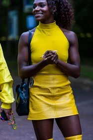 bag, black bag, color, courreges bag, courreges look, Dina Asher Smith, leather bag, leather skirt, mini skirt, skirt, top, yellow skirt, yellow top, street style, jonathan paciullo, FW, frenchystyle, fashion week, PFW, PARIS, SPRING SUMMER 2022, SS 22, vertical, atmosphere details