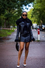 Amina Muaddi, ankle bracelet, black bag, black jacket, black monochrome, black skirt, black sunglasses, black turtleneck, blue nails, courreges look, jacket, leather bag, leather skirt, mini slort, monochrome, prada bag, skirt, sunglasses, turtleneck, white heels, white pumps, zipped skirt, street style, jonathan paciullo, FW, frenchystyle, fashion week, PFW, PARIS, SPRING SUMMER 2022, SS 22, vertical, full length