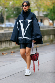 valentino coat, black coat, black parka, black top, black total look, black leather shorts, tight shorts, black sunglasses, futurist shape sunglasses, balenciaga sunglasses, turtleneck top, burgundy leather bag, white sneakers, PARIS, PFW, SPRING SUMMER 2020, SS 20, fashion week, frenchystyle, FW, jonathan paciullo, street style, vertical, full length