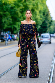 black jumpsuit, fashion week, floral, flower, frenchystyle, full length, FW, izabel goulart, jonathan paciullo, leather bag, MFW, MILAN, model, necklace, off the shoulder, printed jumpsuit, SPRING SUMMER 2017, SS 17, street style, trousers, vertical, yellow bag