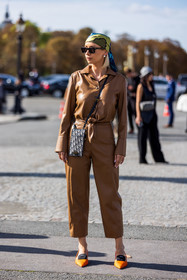 card holder, black sunglasses, camel jumpsuit, dior bag, green scarf, jumpsuit, Justyna Czerniak, leather jumpsuit, logo bag, logo print, orange shoes, printed scarf, scarf, scarf hairstyle, sunglasses, pearl earrings, street style, jonathan paciullo, FW, frenchystyle, fashion week, PFW, PARIS, SPRING SUMMER 2022, SS 22, vertical, full length