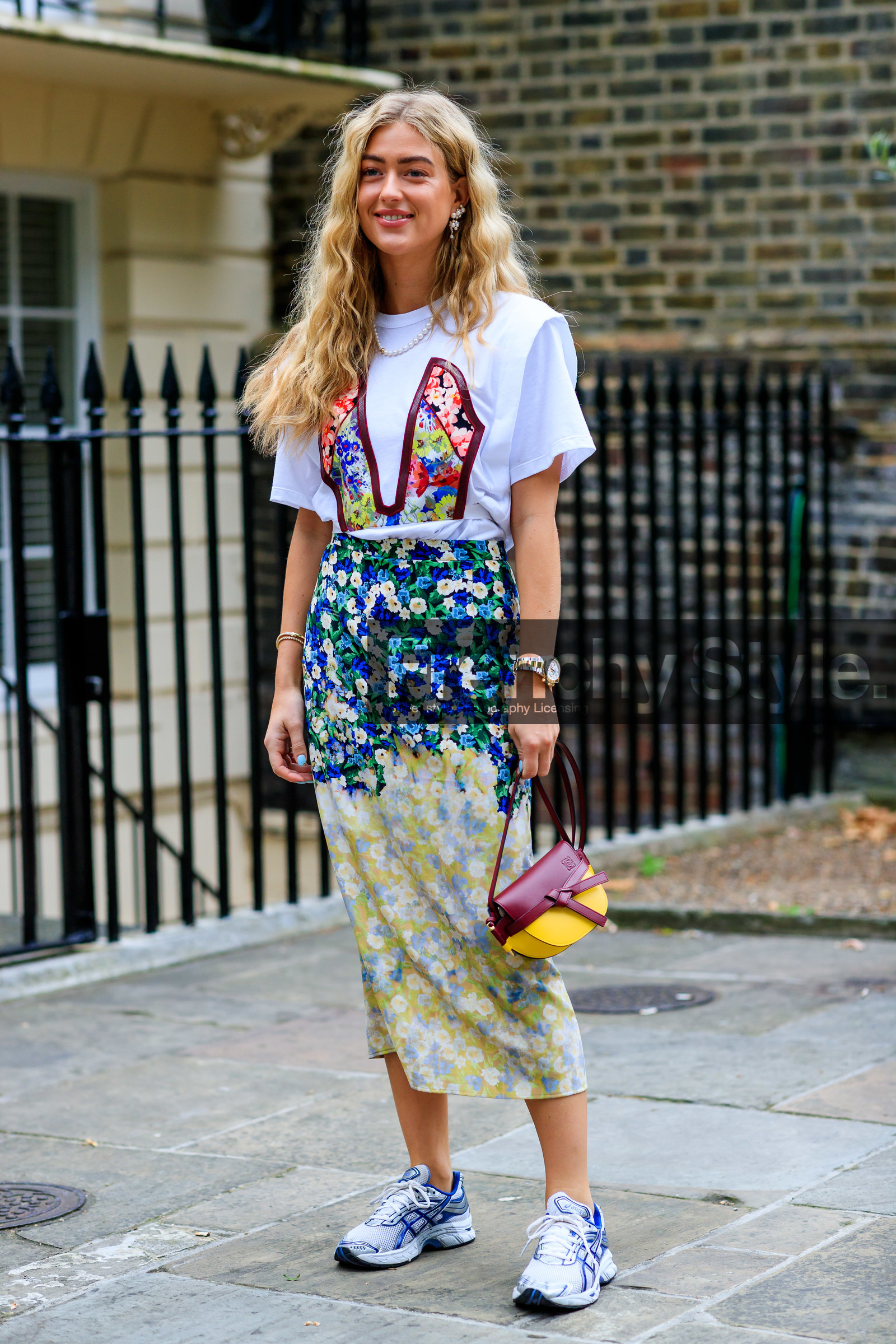 emili sindlev, floral print total look, white t-shirt, short sleeves t-shirt, floral printed skirt, floral printed t-shirt, mid long skirt, silk skirt, rolex watch, silvered and golden watch, silver and golden watch, man style watch, asics sneakers, silvered sneakers, white sneakers, blue sneakers, loewe bag, hand bag, burgundy leather bag, yellow leather bag, light green skirt, blue skirt, tie and dye skirt, pearl earrings, pearl necklace, fashion week, frenchystyle, FW, jonathan paciullo, street style, vertical, full length