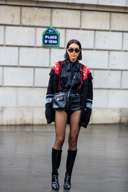 brittany xavier, versace sunglasses, black shirt, black pullover, black tights, black shorts, black leather bag, black sunglasses, black polish boots, vinyl shorts, mini shorts, miu miu bag, miu miu look, miu miu pullover, miu miu shirt, miu miu cardigan, miu miu shorts, lavalliere collar, embroidered pullover, floral embroidered pullover, floral embroidered cardigan, crossbody bag, red cardigan, strassed bag, satin shirt, PARIS, PFW, SPRING SUMMER 2020, SS 20, fashion week, frenchystyle, FW, jonathan paciullo, street style, vertical, full length