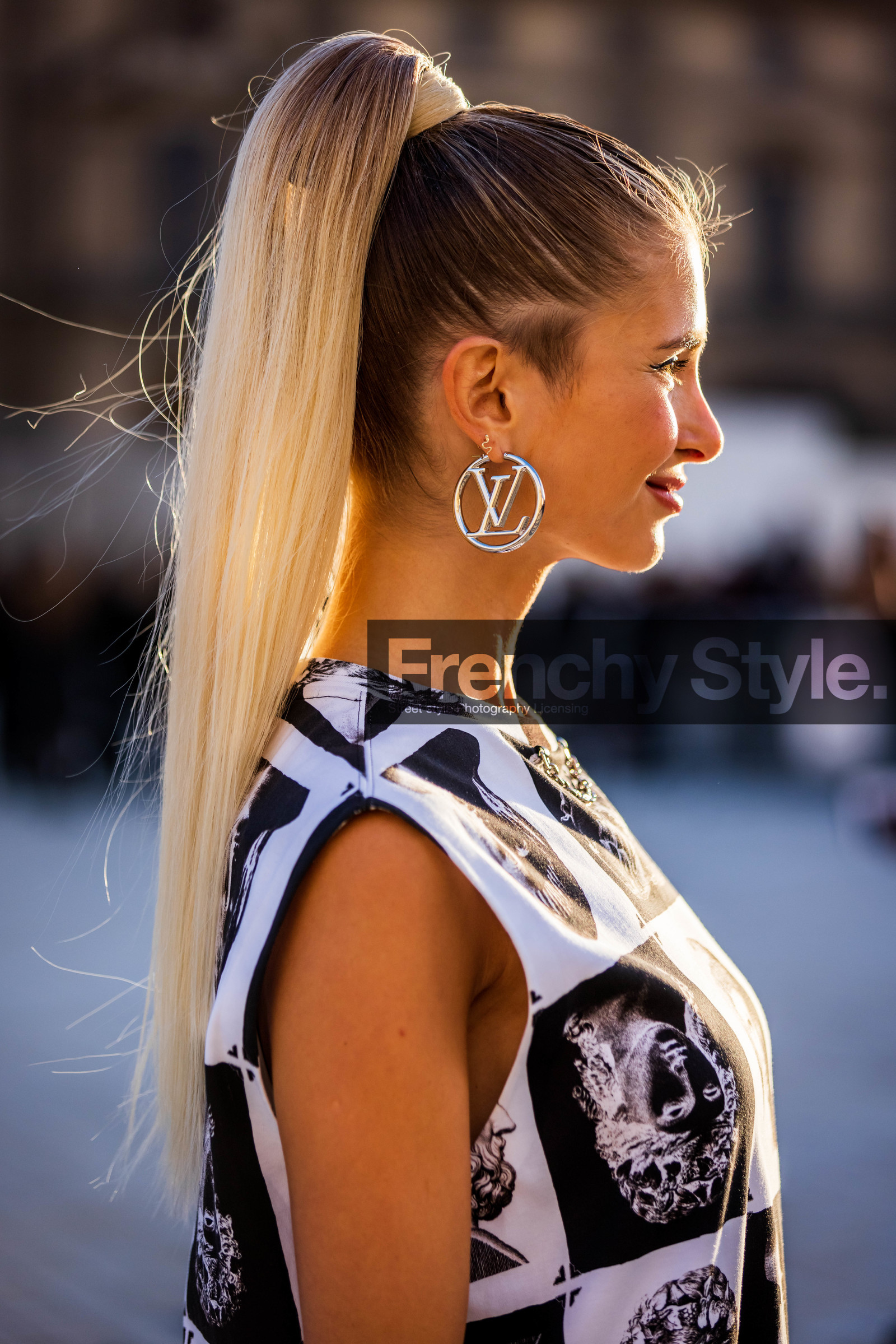 bicolor dress, black and white, black dress, close-up, detail, dress, earrings, hairstyle, logo, louis vuitton earrings, ponytail, printed dress, silver earrings, white dress, Xenia Adonts, fashion week, frenchystyle, FW, jonathan paciullo, street style, PFW, PARIS, SPRING SUMMER 2022, SS 22, vertical, atmosphere details