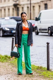bag, black jacket, chanel bag, crop top, denim pants, flare pants, flowers, green bag, green pants, jacket, leather jacket, orange crop top, pants, quilted bag, fashion week, frenchystyle, FW, jonathan paciullo, street style, PFW, PARIS, SPRING SUMMER 2022, SS 22, vertical, full length
