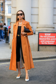 beatrice gutu, orange trench, leather trench coat, long coat, long trench coat, black legging, black top, celine belt, black leather belt, celine sunglasses, black leather clutch, black sunglasses, square shape glasses, pearl necklace, multi earrings, white shoes, sling back shoes, pearl earrings, fashion week, frenchystyle, FW, jonathan paciullo, street style, vertical, full length