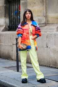 monogrammed bag, vintage bag, beige bag, logo printed bag, gucci bag, zipped jacket, rainbow jacket, multicolor jacket, denim, denim jacket, red jacket, orange jacket, purple jacket, yellow pants, light yellow pants, flare pants, high waist pants, black leather boots, big buckle shoes, big buckle boots, platform boots, big sole boots, barbara malewicz, fashion week, frenchystyle, FW, jonathan paciullo, street style, PFW, PARIS, SPRING SUMMER 2022, SS 22, vertical, full length