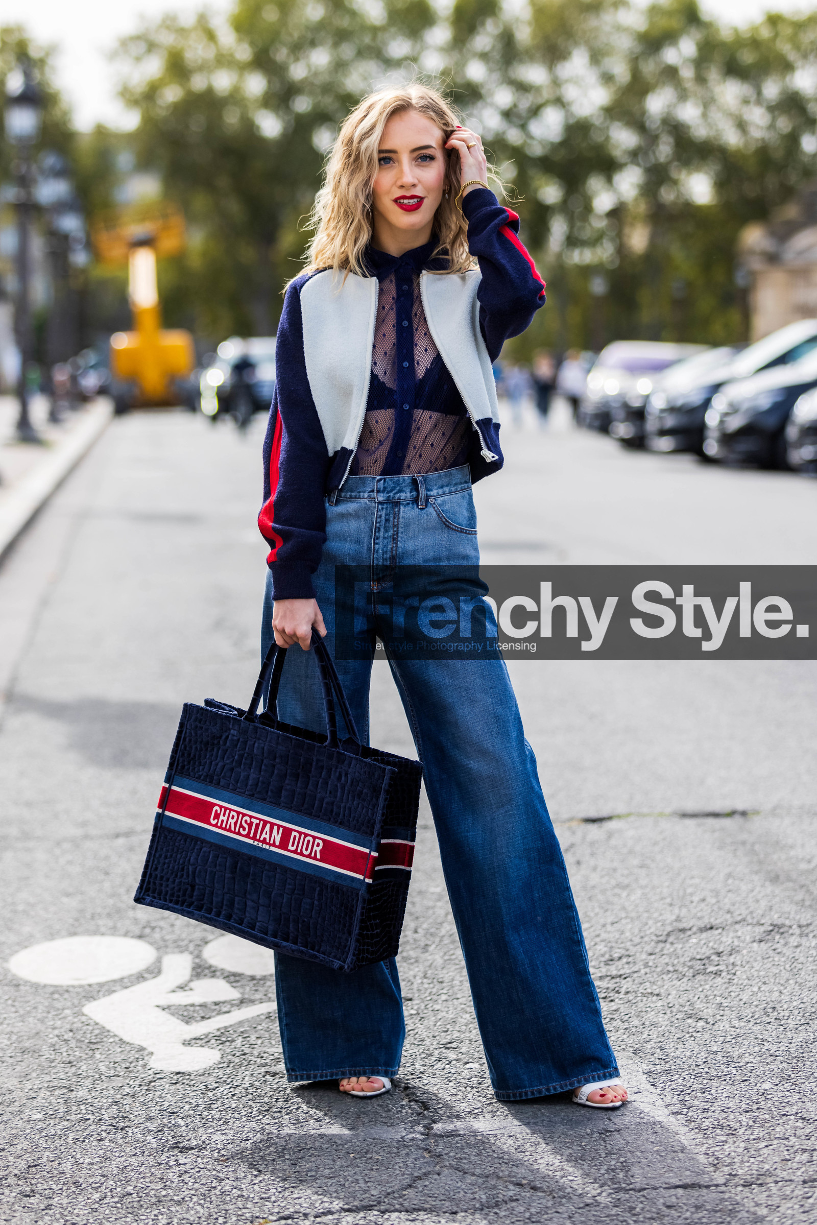 blue bag, blue jacket, blue jean, denim, dior bag, dior print, flare denim, jean, logo print, navy bra, navy shirt, oversize bag, plumetis shirt, print, printed bag, red lips, Sarah Mikaela, shirt, totebag, transparent shirt, white sandals, zipped jacket, street style, jonathan paciullo, FW, frenchystyle, fashion week, PFW, PARIS, SPRING SUMMER 2022, SS 22, vertical, full length