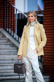 xenia adonts, light yellow jacket, beige jacket, white pullover, white pants, satin pants, turtleneck pullover, loose pants, hermes jacket, golden necklace, golden earrings, golden ring, multi earrings, big chain necklace, brown leather bag, hermes bag, kelly hermes bag, hoop earrings, mini hoop earrings, diamond earrings, white total look, beige total look, PARIS, PFW, fashion week, frenchystyle, FW, jonathan paciullo, street style, SPRING SUMMER 2021, SS 21, vertical, full length