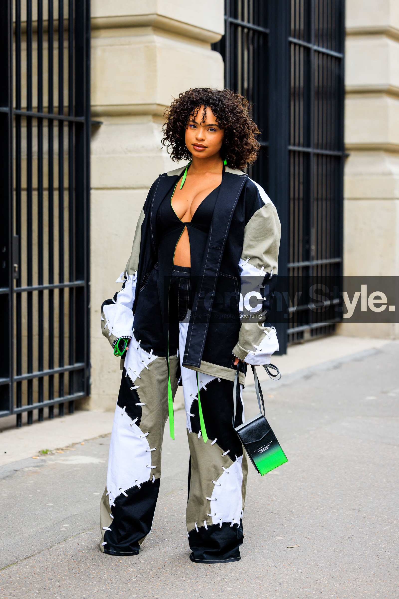 curls, neon green earrings, cut out top, black top, patched jacket, denim jacket, blue and kaki jacket, patched pants, denim pants, crossbody bag, black crossbody bag, neon green bag, paola locatelli, fashion week, frenchystyle, FW, jonathan paciullo, street style, AUTUMN WINTER 2022-2023, FALL WINTER 2022_2023, FW 22-23, PFW, PARIS, vertical, full length