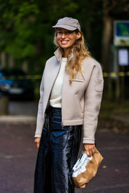 Alexandra Golovanoff, bicolor bag, bicolor pouch, black skirt, black socks, camel pouch, cap, courreges jacket, grey cap, grey jacket, jacket, leather pouch, leather skirt, long skirt, patent skirt, pouch, skirt, white jumper, white knitwear, white pouch, street style, jonathan paciullo, FW, frenchystyle, fashion week, PFW, PARIS, SPRING SUMMER 2022, SS 22, vertical, atmosphere details