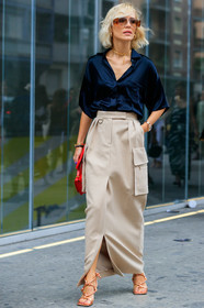 viktoria rader, max mara skirt, max mara look, max mara shirt, black shirt, silk shirt, short sleeves shirt, embroidered shirt, smoked sunglasses, hoop earrings, golden earrings, golden necklace, chain necklace, loose shirt, light beige skirt, long skirt, multi pocket skirt, red leather bag, hand bag, golden sandals, multi straps sandals, high heels sandals, knot details shoes, fashion week, frenchystyle, FW, jonathan paciullo, street style, MFW, MILAN, SPRING SUMMER 2020, SS 20