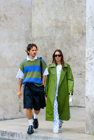 green leather coat, white t-shirt, white leather bag, mini bag, hand bag, letter printed bag, long coat, oversize coat, oversize t-shirt, checked pants, white pants, light blue pants, flare pants, silk pants, blue pants, bicolor pants, alice barbier, striped pullover, oversize pullover, green pullover, blue pullover, short sleeves pullover, sleeveless pullover, white polo shirt, black bermuda shorts, loose shorts, white socks, black leather loafers, prada shoes, prada loafers, JS roques, fashion week, frenchystyle, FW, jonathan paciullo, street style, PFW, PARIS, SPRING SUMMER 2022, SS 22, vertical, full length