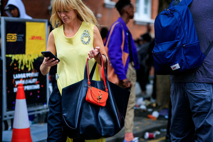 jeanette madsen, yellow dress, sleeveless dress, strassed pin, bag detail, shopping bag, black leather bag, orange leather bag, mini bag, close up detail, j w anderson bag, fashion week, frenchystyle, FW, jonathan paciullo, street style, atmosphere details, horizontal, detail
