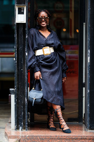 black dress, long sleeves dress, scale sunglasses, bottega veneta sunglasses, butterfly sunglasses, golden earrings, diamond earrings, round shape earrings, dress shirt, button dress, belted dress, white leather belt, golden buckle belt, black shoes, suede shoes, laced shoes, black leather bag, hand bag, lois opoku, street style, jonathan paciullo, FW, frenchystyle, fashion week, MFW, MILAN, SPRING SUMMER 2021, SS 21, vertical, full length