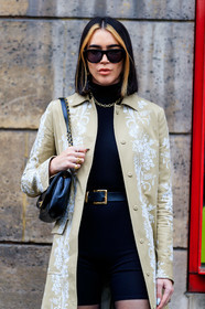 brittany xavier, black top, black sunglasses, black shorts, black tights, black leather bag, shoulder bag, chanel bag, black leather belt, tight shorts, belted top, turtleneck top, bottega veneta sunglasses, beige trench coat, white trench coat, floral embroidered trench coat, golden rings, diamond ring, multi rings, fashion week, frenchystyle, FW, jonathan paciullo, street style, PFW, PARIS, vertical, atmosphere details, detail