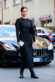 black leather clutch, black leather boots, black dress, long sleeves dress, long dress, tight dress, make up, make up details, black make up, black eyeliner, dangling earrings, strassed earrings, pearl earrings, valentino earrings, high boots, flat boots, split dress, valentino bag, quilted bag, studs bag, valentino dress, black total look, black leather bag, fiona zanetti, street style, jonathan paciullo, FW, frenchystyle, fashion week, MFW, MILAN, SPRING SUMMER 2021, SS 21, vertical, full length