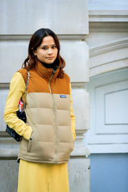 beige jacket, black bag, down jacket, leather bag, patagonia, sleeveless, yellow dress, fashion week, frenchystyle, FW, jonathan paciullo, street style, LFW, LONDON, AUTUMN WINTER 2019-2020, AW 19-20, FW 19-20, FALL WINTER 2019-2020, vertical, atmosphere details, detail