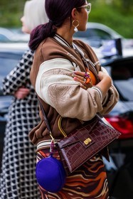 crossbody bag, handbag, pattern, print, baseball jacket, bomber jacket, skirt, jacket, earrings, glasses, ring, orange, fashion week, frenchystyle, FW, jonathan paciullo, street style, SPRING SUMMER 2022, SS 22, LFW, LONDON, vertical, atmosphere details, detail