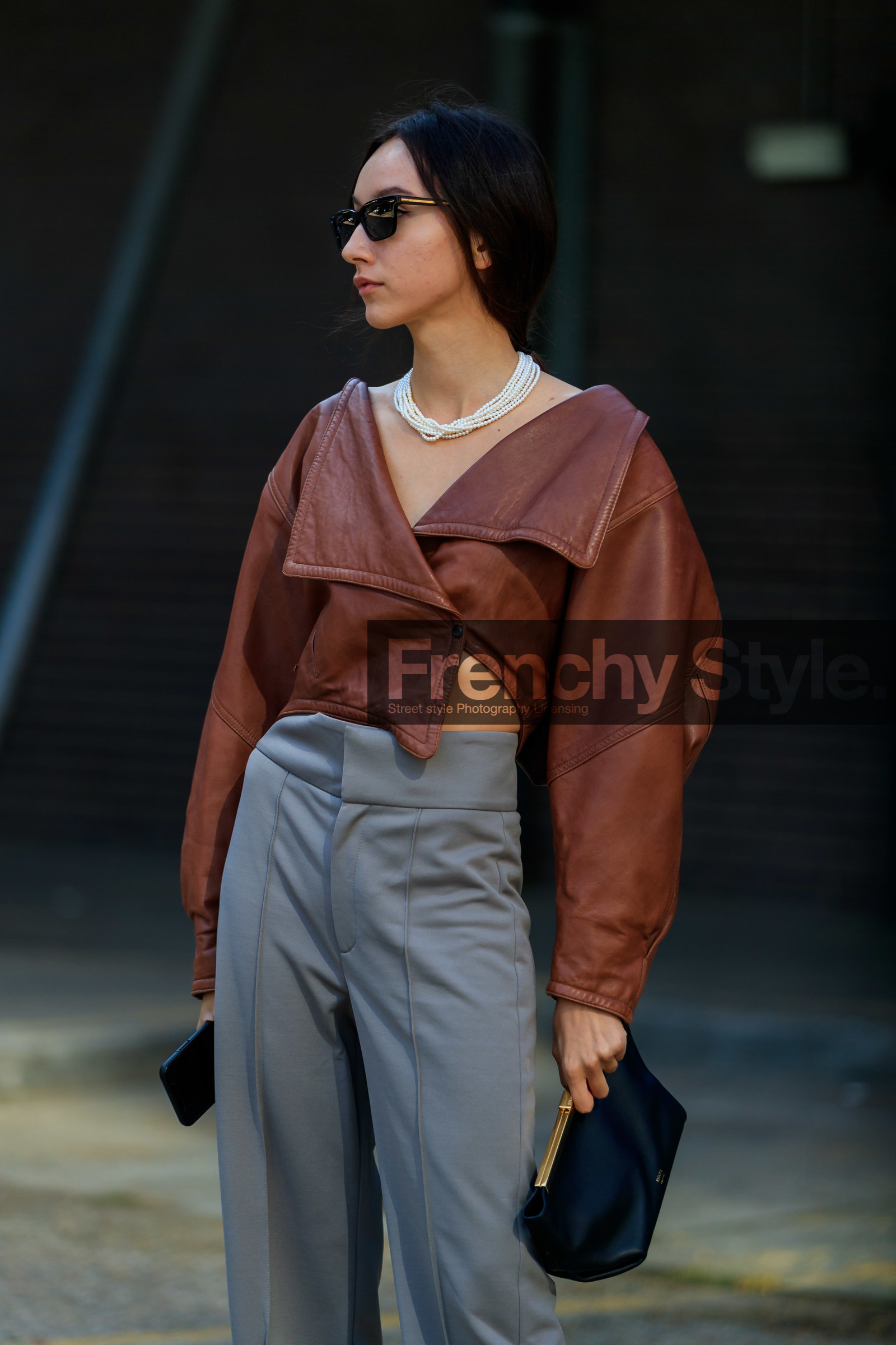 beatrice gutu, brown leather top, cropped top, asymmetrical top, long sleeves top, grey pants, white leather shoes, sharp end shoes, khaite bag, black leather clutch, multi necklace, pearl necklace, black sunglasses, fashion week, frenchystyle, FW, jonathan paciullo, street style, vertical, detail, atmosphere details