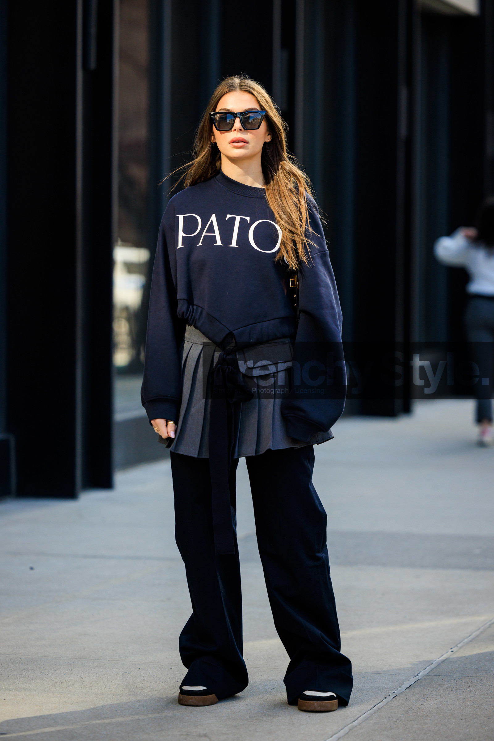 patou black sweatshirt, black cat eye sunglasses, silver pleated skirt, school girl skirt, oversiwed black pants, black and white sneakers, Allegra shaw, fashion week, frenchystyle, FW, jonathan paciullo, street style, NYFW, NEW YORK, AUTUMN WINTER 2022-2023, FALL WINTER 2022_2023, FW 22-23, vertical, full length