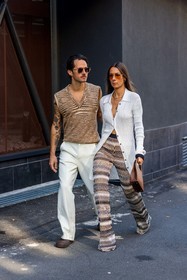 Alice Barbier, beige knit, beige pants, brown bag, brown clog, couple, duo, fluid pants, Jean-Sebastien Roques, knitted pants, leather bag, missoni look, orange sunglasses, printed pants, ribbed cardigan, sleveless knit, striped knit, sunglasses, white cardigan, white pants, v-neck knit, fashion week, frenchystyle, FW, jonathan paciullo, street style, MFW, MILAN, SPRING SUMMER 2022, SS 22, vertical, full length, menswear