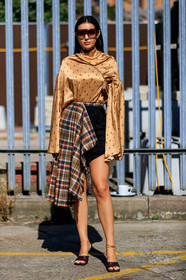 doina ciobanu, aviator sunglasses, brown scale sunglasses, high collar blouse, satin blouse, monogrammed blouse, oversize sleeves, crossbody bag, light brown bag, brown leather bag, mini bag, square shape bag, asymmetrical skirt, checked skirt, plaid skirt, beige skirt, black shorts, high waist shorts, embroidered shorts, velvet shorts, dark brown sandals, brown leather sandals, ankle bracelet, golden bracelet, chain bracelet, carrera sunglasses, multi rings, golden rings, fashion week, frenchystyle, FW, jonathan paciullo, street style, vertical, full length