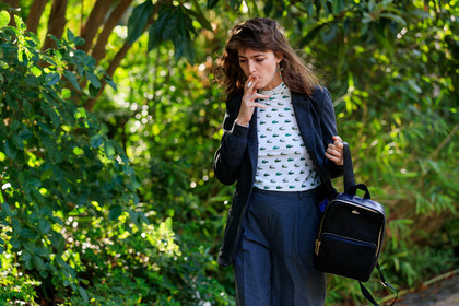 dark grey jacket, dark grey pants, dark grey suits, carrot pants, white top, tight top, monogrammed top, animal print top, green top, sportswear top, high collar top, lacoste bag, lacoste top, backpack, black leather bag, dangling earrings, green stone earrings, cross shape earrings, PARIS, PFW, SPRING SUMMER 2020, SS 20, fashion week, frenchystyle, FW, jonathan paciullo, street style, horizontal, atmosphere details, detail