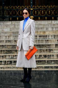 julia restoin roitfeld, erika boldrin, light beige jacket, light beige skirt, orange leather clutch, hermes clutch, bottega veneta sunglasses, metalic frame sunglasses, aviator sunglasses, geometric shape glasses, blue pullover, turtleneck pullover, mid long skirt, split skirt, black tights, black suede shoes, pump, fashion week, frenchystyle, FW, jonathan paciullo, street style, PFW, PARIS, vertical, full length