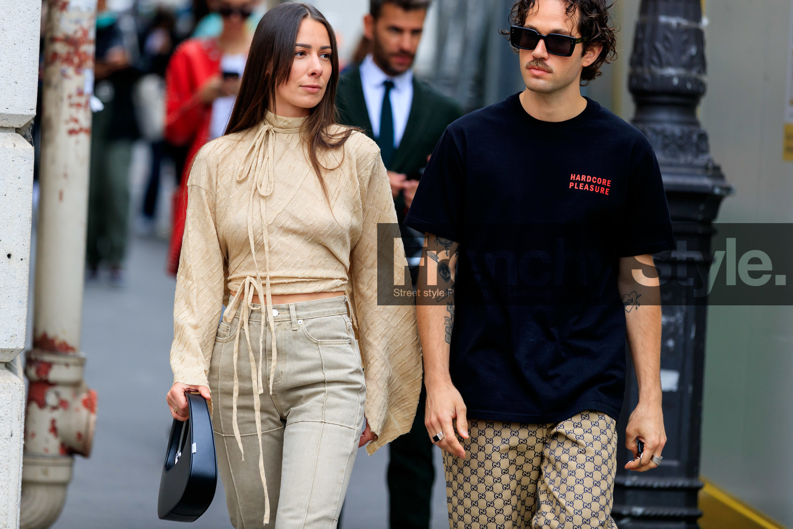 nude blouse, light beige blouse, beige blouse, cropped blouse, high collar blouse, high collar, high waist jeans, beige jeans, denim, striped blouse, knot details, knoted blouse, black leather bag, round shape bag, hand bag, coperni bag, black t-shirt, letter printed t-shirt, red t-shirt, gucci pants, beige pants, monogrammed pants, black sunglasses, square shape glasses, tatoo, tatoo detail, alice & j.s, alice barbier, JS roques, fashion week, frenchystyle, FW, jonathan paciullo, street style, PFW, PARIS, SPRING SUMMER 2022, SS 22, horizontal, atmosphere details, detail