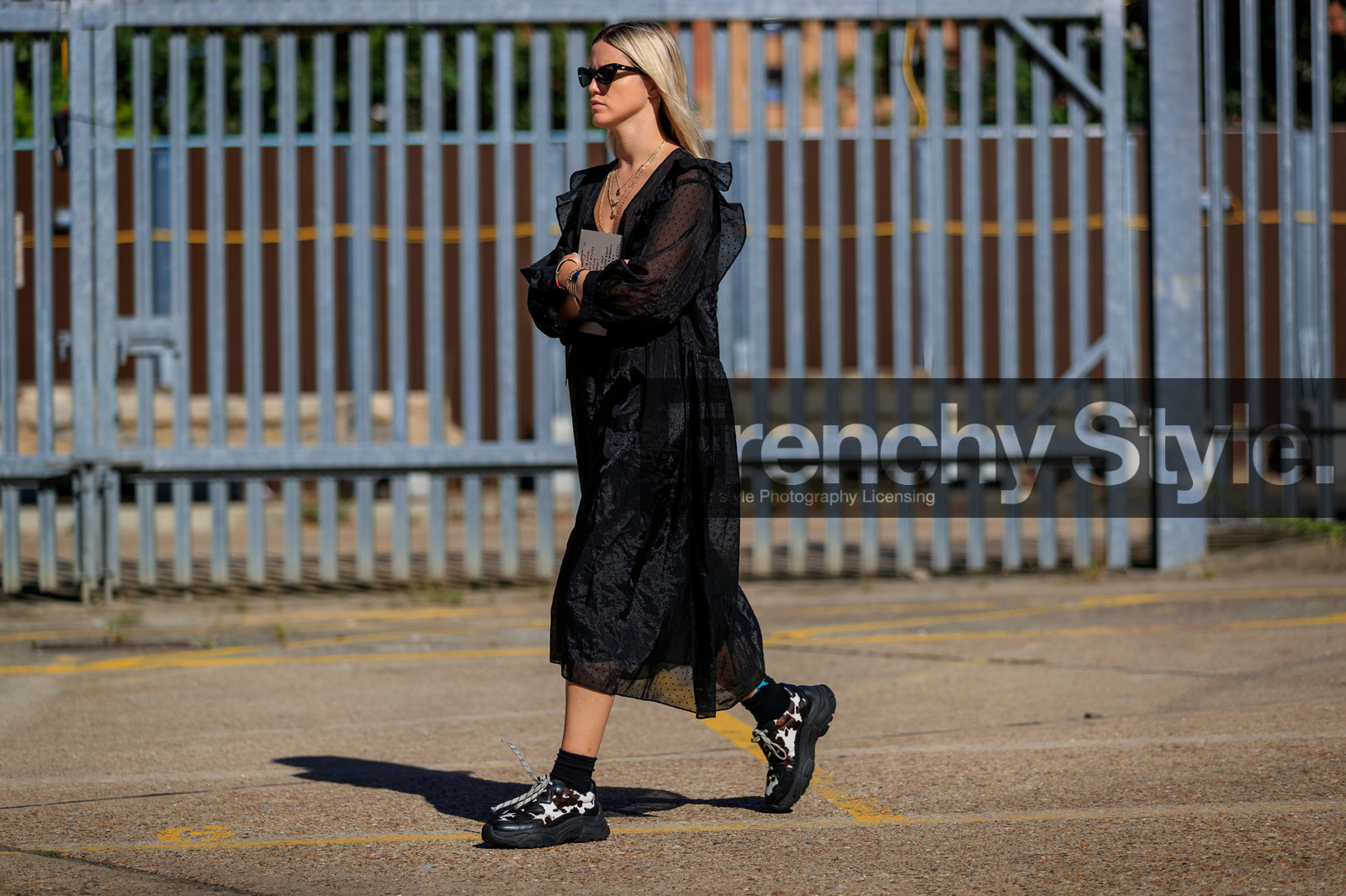 black sunglasses, butterfly sunglasses, black dress, ruffle dress, polka dots dress, embroidered dress, loose dress, mid long dress, multi necklace, golden necklace, charms necklace, lucky charm bracelet, animal print shoes, fur shoes, laced shoes, big sole shoes, black socks, fashion week, frenchystyle, FW, jonathan paciullo, street style, atmosphere details, horizontal, full length