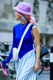 black bag, blue dress, blue gloves, bodysuit, bucket hat, dyed hair, graphic bag, graphic dress, graphic skirt, leather bag, necklace, pink hair, pink hat, printed bag, printed dress, printed skirt, stripes, white bag, fashion week, frenchystyle, FW, jonathan paciullo, street style, LFW, LONDON, AUTUMN WINTER 2019-2020, AW 19-20, FW 19-20, FALL WINTER 2019-2020, vertical, atmosphere details, detail