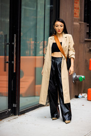 long beige trench, black wideleg leather pants, beig stilettos, black cropped top, orange crossbody bag, jessica wang, fashion week, frenchystyle, FW, jonathan paciullo, street style, NYFW, NEW YORK, AUTUMN WINTER 2022-2023, FALL WINTER 2022_2023, FW 22-23, vertical, full length