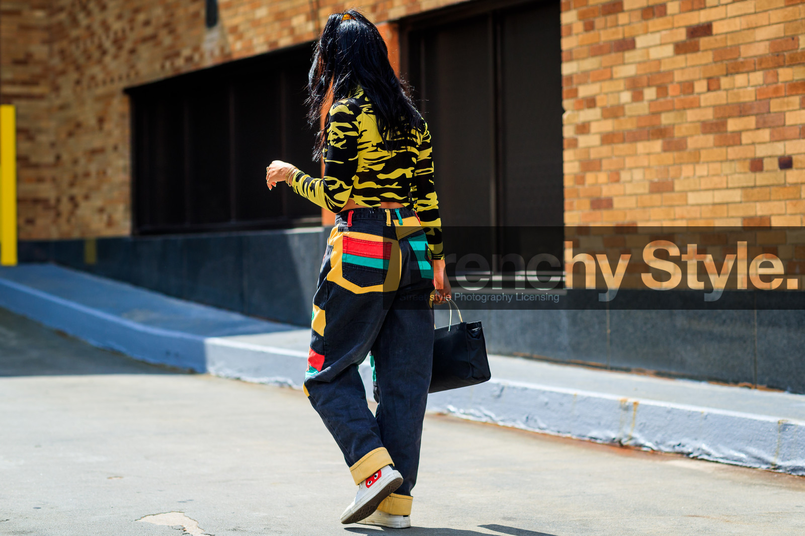 atmosphere details, black bag, converse, cropped top, denim pants, fashion week, frenchystyle, full length, FW, graphic sweater, horizontal, jeans, jonathan paciullo, leather bag, multicolor pants, NEW YORK, NYFW, patchwork, ponytail, prada, printed sweater, SPRING SUMMER 2018, SS 18, street style, trousers, white sneakers, yellow pants, yellow sweater, zebra