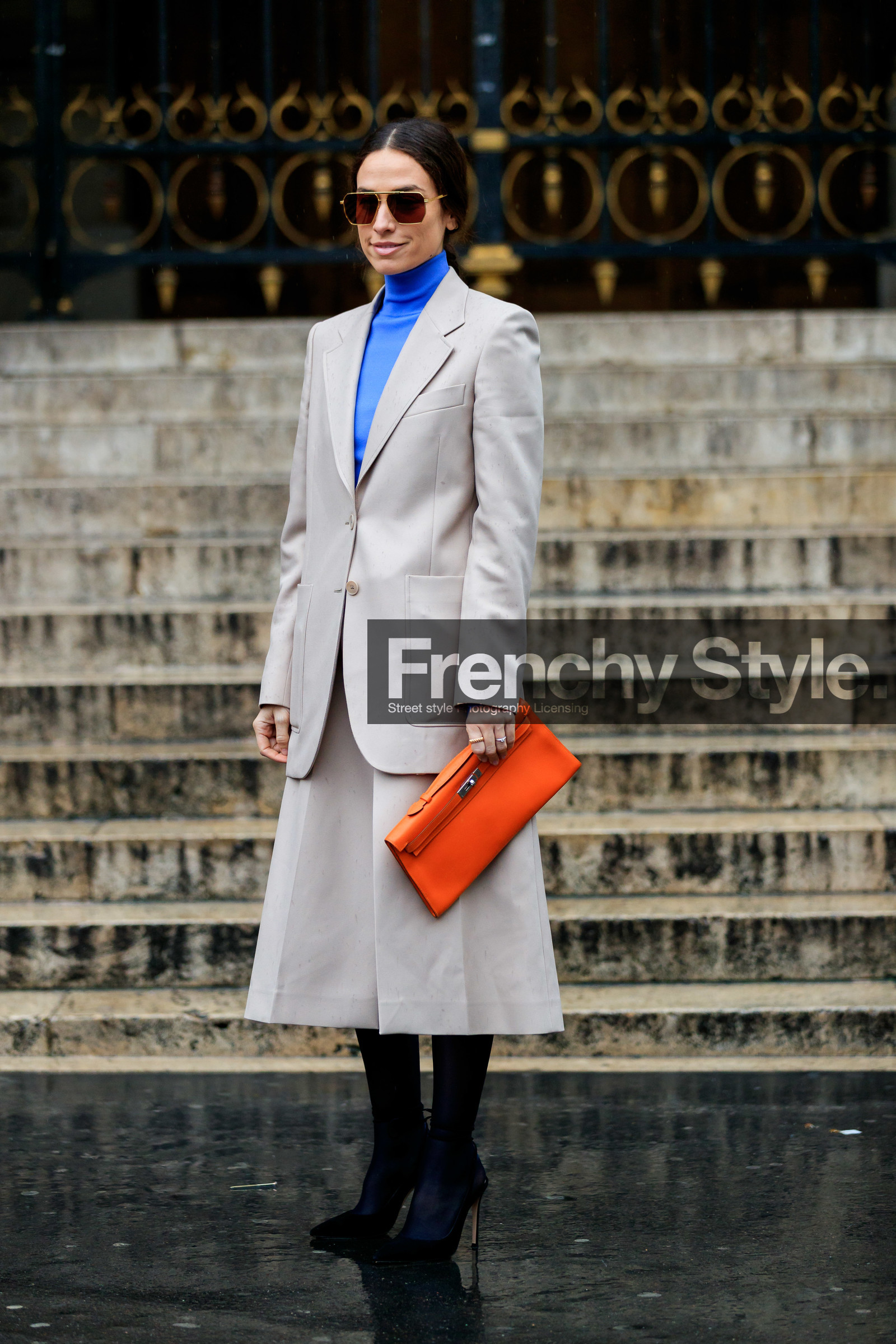 julia restoin roitfeld, erika boldrin, light beige jacket, light beige skirt, orange leather clutch, hermes clutch, bottega veneta sunglasses, metalic frame sunglasses, aviator sunglasses, geometric shape glasses, blue pullover, turtleneck pullover, mid long skirt, split skirt, black tights, black suede shoes, pump, fashion week, frenchystyle, FW, jonathan paciullo, street style, PFW, PARIS, vertical, full length