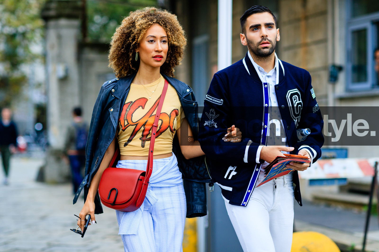 american, atmosphere details, black jacket, black perfecto, blue pants, blue shirt, curly hair, denim pants, detail, elaine welteroth, fashion week, frenchystyle, FW, horizontal, jeans, jonathan paciullo, leather bag, leather jacket, leather perfecto, MFW, MILAN, navy jacket, opening ceremony, over the shoulder, printed t shirt, red bag, red lips, SPRING SUMMER 2017, SS 17, street style, teddy jacket, trousers, white denim, yellow t shirt