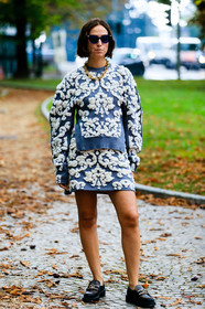 knit skirt, knitwear, mini skirt, blue skirt, blue pullover, floral embroidered skirt, floral embroidered pullover, white skirt, white pullover, brown leather loafers, black leather loafers, monogrammed shoes, monogrammed loafers, louis vuitton shoes, flat shoes, oversize shoulder, blue sunglasses, bottega veneta sunglasses, velvet skirt, velvet bag, big chain necklace, golden necklace, erika boldrin, street style, jonathan paciullo, FW, frenchystyle, fashion week, MFW, MILAN, SPRING SUMMER 2021, SS 21, vertical, full length