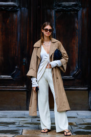 beige trench coat, camel trenchcoat, white top, white pants, knit pants, knitwear, laced top, asymmetrical top, cropped top, scale sunglasses, bottega veneta sunglasses, black sandals, flat sandals, flip flop shoes, silvered necklace, multi necklace, jacqueline zelwis, street style, jonathan paciullo, FW, frenchystyle, fashion week, MFW, MILAN, SPRING SUMMER 2021, SS 21, vertical, full length
