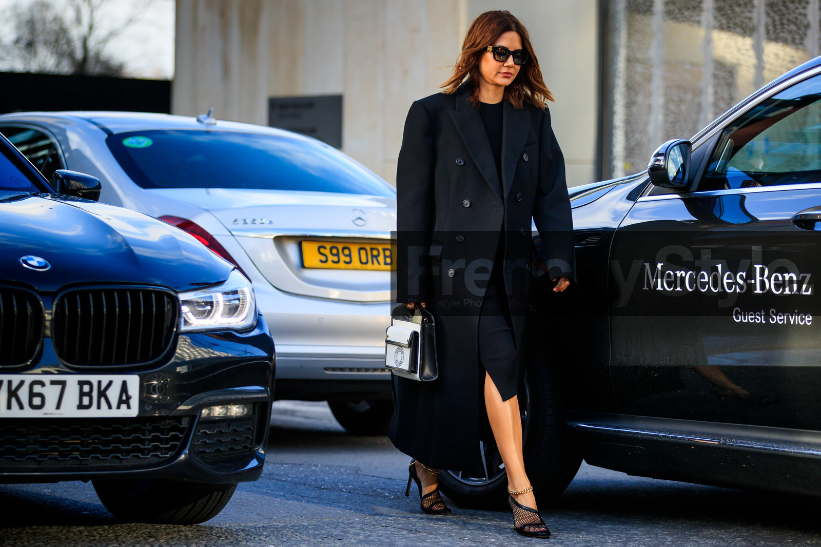 Christine Centenera, black coat, black dress, black shoes, black leather bag, scale sunglasses, louis vuitton sunglasses, oversize coat, mid long dress, fishnet shoes, ankle bracelet, bottega veneta shoes, white bag, logo printed bag, burberry bag, hand bag, fashion week, frenchystyle, FW, jonathan paciullo, street style, LFW, LONDON, AUTUMN WINTER 2020-2021, FALL WINTER 2020-2021, FW 20-21, horizontal, atmosphere details, full length