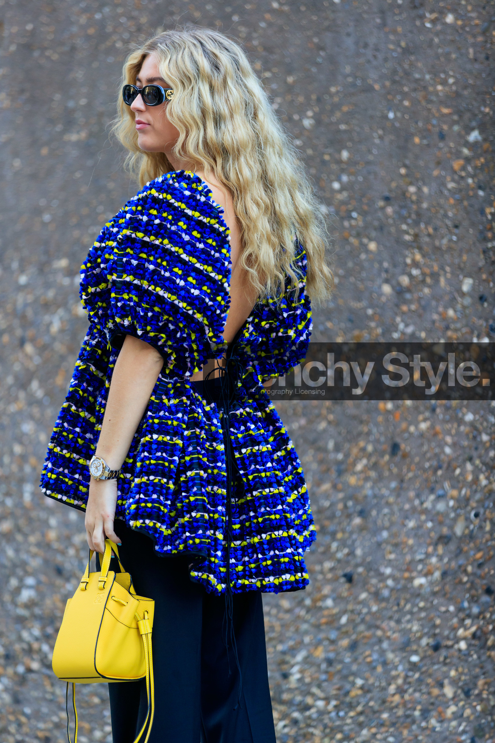 emili sindlev, gucci sunglasses, black sunglasses, knit top, multicolor top, loewe bag, mini bag, hand bag, yellow leather bag, black pants, rolex watch, silvered and golden watch, fashion week, frenchystyle, FW, jonathan paciullo, street style, vertical, detail, atmosphere details