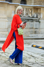red pullover, red dress, knitwear, knit dress, long pullover, split pullover, blue jeans, flare jeans, sheer sandals, sheer heels, plastic sandals, plastic heels, yellow leather bag, scale strap bag, hand bag, dangling earrings, pearl earrings, fashion week, frenchystyle, FW, jonathan paciullo, street style, PFW, PARIS, SPRING SUMMER 2020, SS 20, horizontal, full length