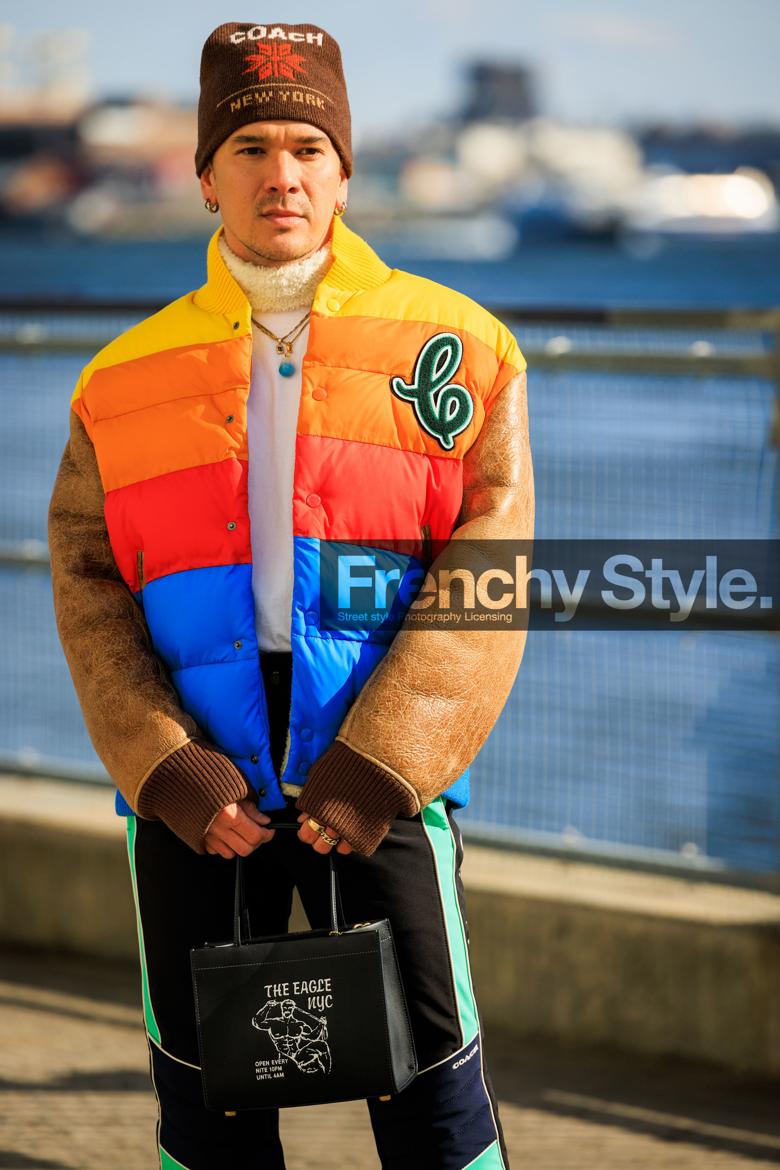 multicolor winter jacket, puffy jacket, ski look, puffed pants, black printed pants, brown beanie, printed beanie, black handbag, white turtleneck top, pendant necklace, closeup, silver earrings, motif handbag, fashion week, frenchystyle, FW, jonathan paciullo, street style, NYFW, NEW YORK, AUTUMN WINTER 2022-2023, FALL WINTER 2022_2023, FW 22-23, vertical, atmosphere details