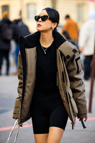 black sunglasses, golden loops, silver necklaces, black body suit, winter jacket, sporty look, white handbag, prada bag, puffed jacket, brown jacket, fashion week, frenchystyle, FW, jonathan paciullo, street style, PFW, PARIS, menswear, AUTUMN WINTER 2022-2023, FALL WINTER 2022-2023, FW 22-23, atmosphere details, detail, vertical
