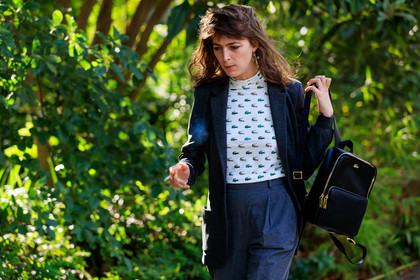 dark grey jacket, dark grey pants, dark grey suits, carrot pants, white top, tight top, monogrammed top, animal print top, green top, sportswear top, high collar top, lacoste bag, lacoste top, backpack, black leather bag, dangling earrings, green stone earrings, cross shape earrings, PARIS, PFW, SPRING SUMMER 2020, SS 20, fashion week, frenchystyle, FW, jonathan paciullo, street style, horizontal, atmosphere details, detail