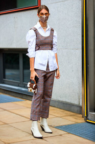 brown top, brown pants, red pants, red top, sleeveless top, cropped pants, cropped top, checked pants, checked top, white shirt, layered bra, layered top, fur bag, mini bag, hand bag, white leather boots, cowboy boots, metalic frame sunglasses, aviator sunglasses, silvered necklace, big chain necklace, multi necklace, covid face mask, jacqueline zelwis, street style, jonathan paciullo, FW, frenchystyle, fashion week, MFW, MILAN, SPRING SUMMER 2021, SS 21, vertical, full length