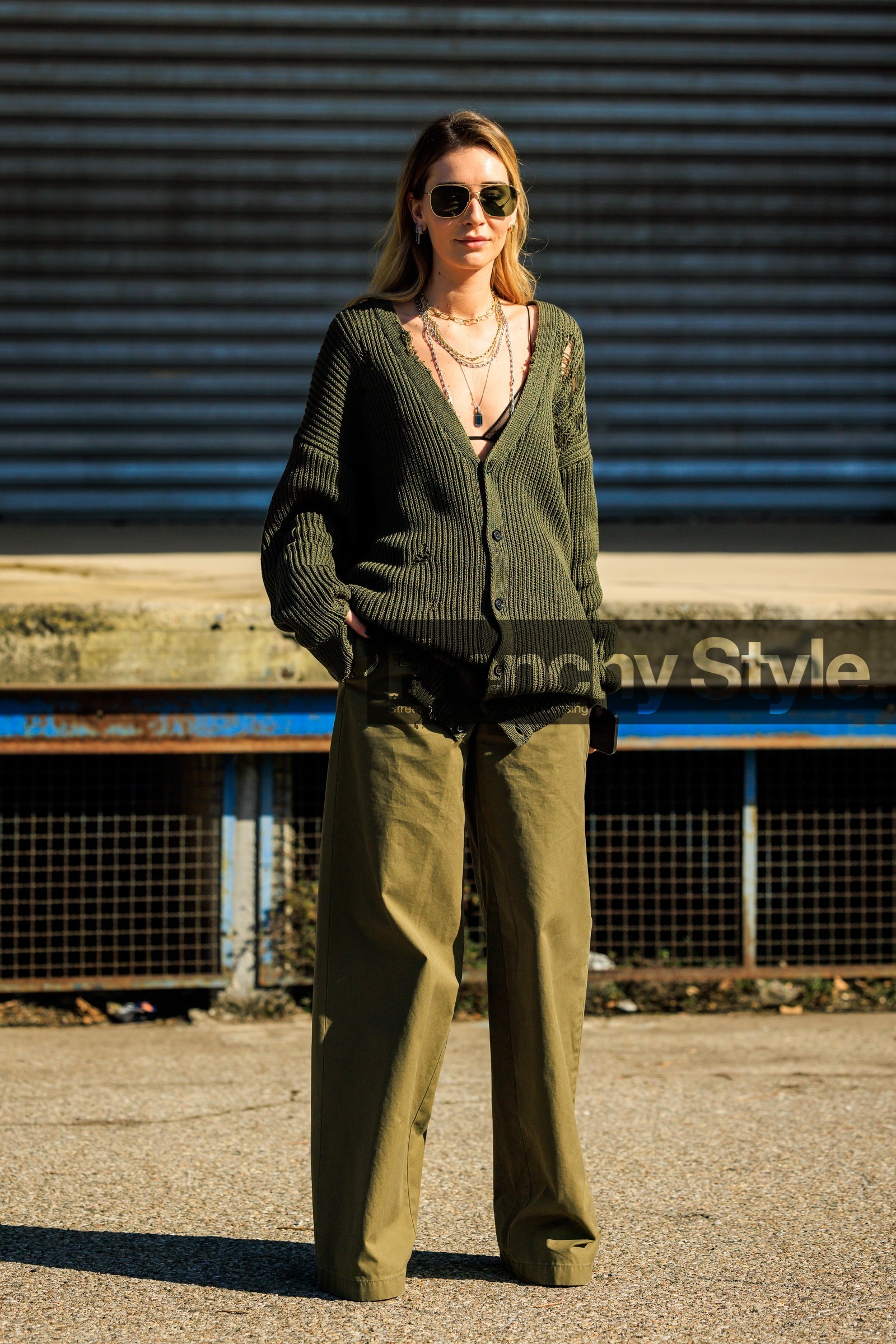 green cardigan, hole cardigan, knitted cardigan, black sunglasses, pilot sunglasses, green pants, multiple necklaces, black sunglasses, baggy pants, chiara capitani, fashion week, frenchystyle, FW, jonathan paciullo, street style, vertical, full length