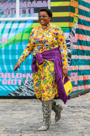 gabriella karefa johnson, yellow top, yellow skirt, yellow leather bag, floral printed skirt, floral printed top, turtleneck top, prada top, mid long skirt, tight top, long sleeves top, purple jacket, denim jacket, beige leather boots, animal skin boots, high boots, green sunglasses, aviator sunglasses, metalic frame sunglasses, hand bag, animal skin bag, fashion week, frenchystyle, FW, jonathan paciullo, street style, PFW, PARIS, SPRING SUMMER 2020, SS 20, horizontal, full length