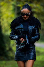 Amina Muaddi, black bag, black jacket, black monochrome, black skirt, black sunglasses, black turtleneck, blue nails, courreges look, jacket, leather bag, leather skirt, mini slort, monochrome, skirt, sunglasses, turtleneck, street style, jonathan paciullo, FW, frenchystyle, fashion week, PFW, PARIS, SPRING SUMMER 2022, SS 22, vertical, atmosphere details
