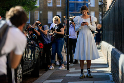 victoria sekrier, white dress, mid long dress, balloon sleeves, brown scale sunglasses, celine sunglasses, hoop earrings, golden earrings, long sleeves dress, brown leather bag, louis vuitton boots, louis vuitton sneakers, high sneakers, laced shoes, white leather shoes, white leather sneakers, golden sole, fashion week, frenchystyle, FW, jonathan paciullo, street style, atmosphere details, horizontal, detail